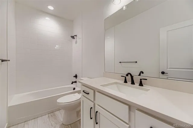 a view of an empty room and closet area