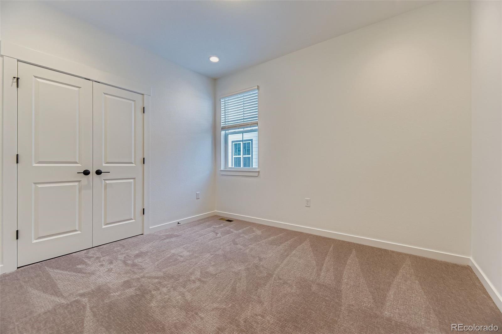 8905 South Riviera Way Aurora, CO 80016 - Photo 19 of 27 a view of an empty room and closet area