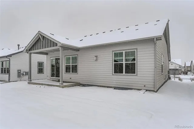 a front view of a house with large windows