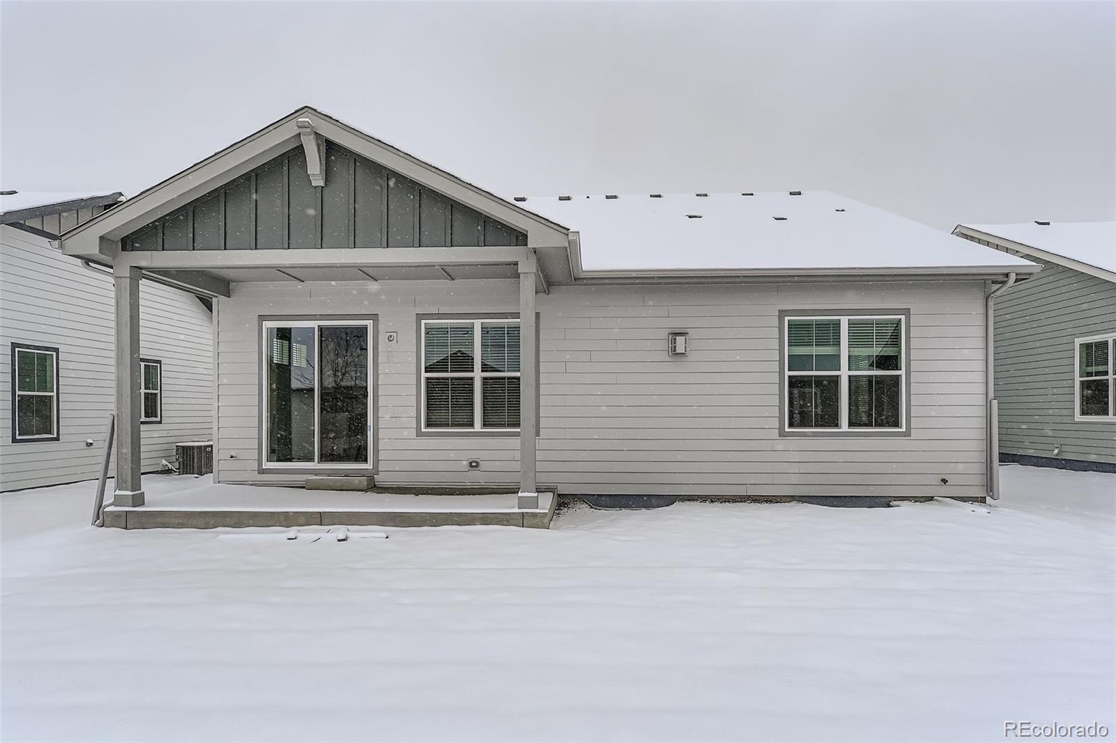 8905 South Riviera Way Aurora, CO 80016 - Photo 27 of 27 a front view of a house with large windows