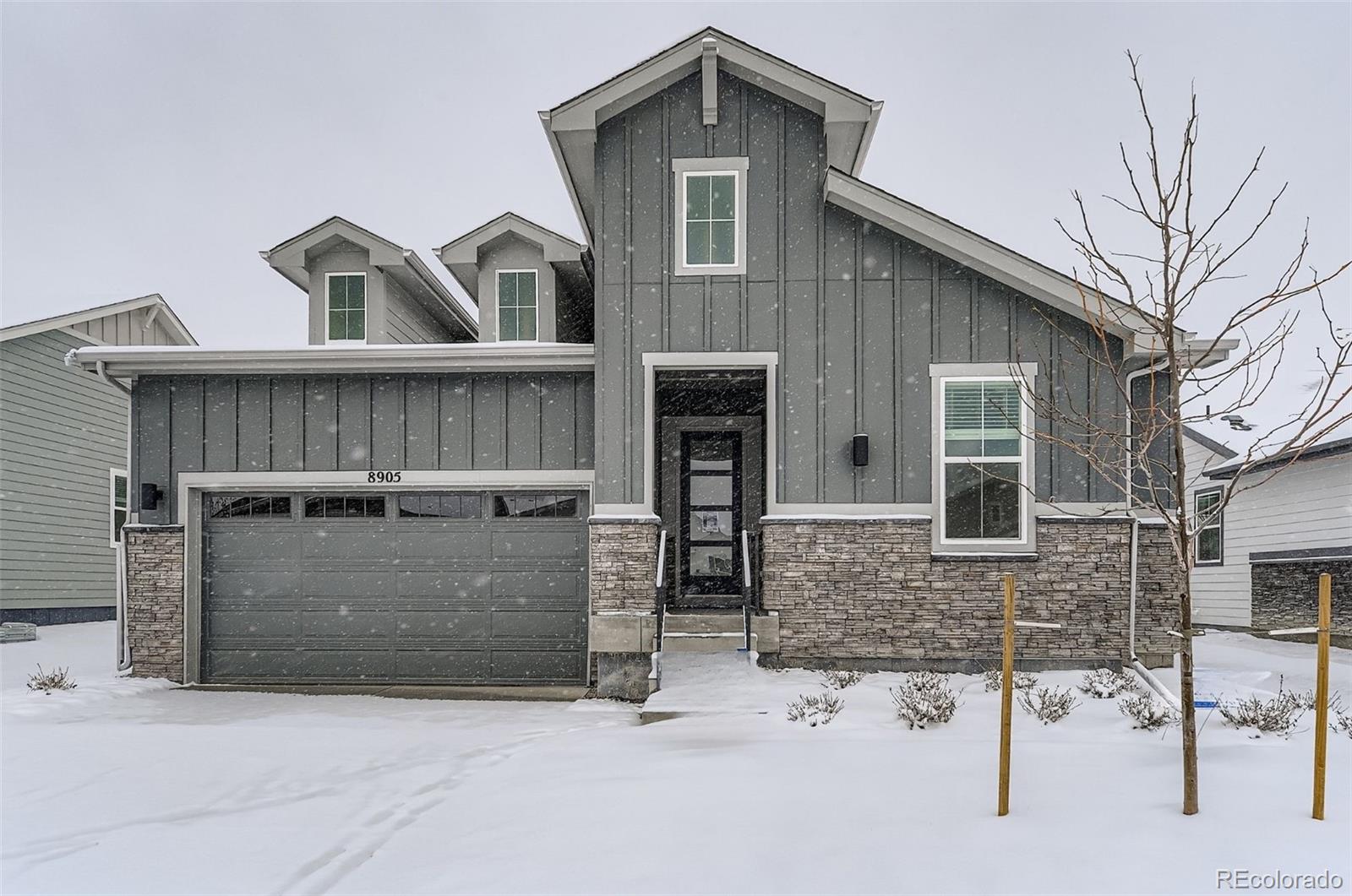 8905 South Riviera Way Aurora, CO 80016 - Photo 3 of 27 a front view of a house with glass windows