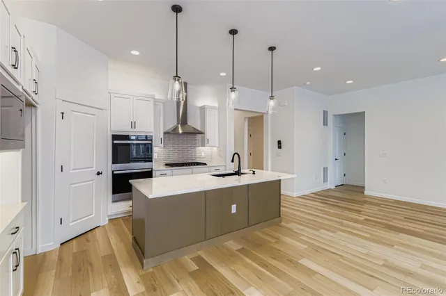 a kitchen with sink and window