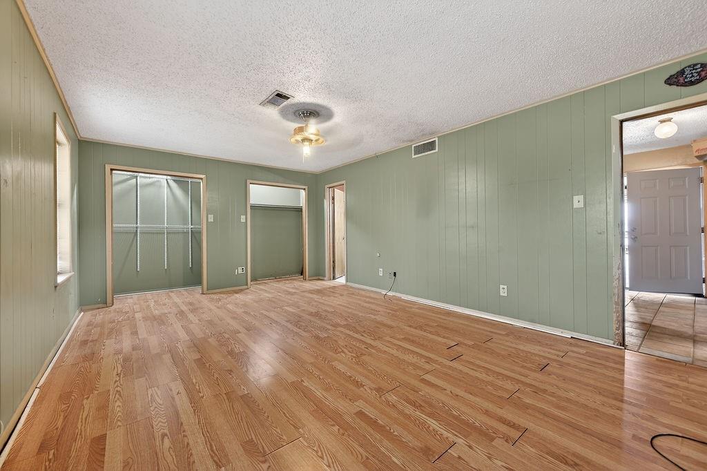 9474 Fm 804 Larue, TX 75770 - Photo 6 of 25 a view of a room with wooden floor and ceiling fan
