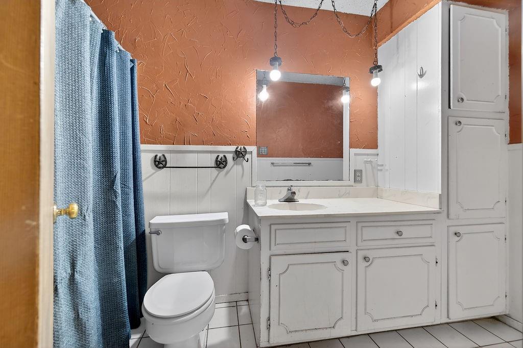 9474 Fm 804 Larue, TX 75770 - Photo 7 of 25 a bathroom with a toilet sink and mirror