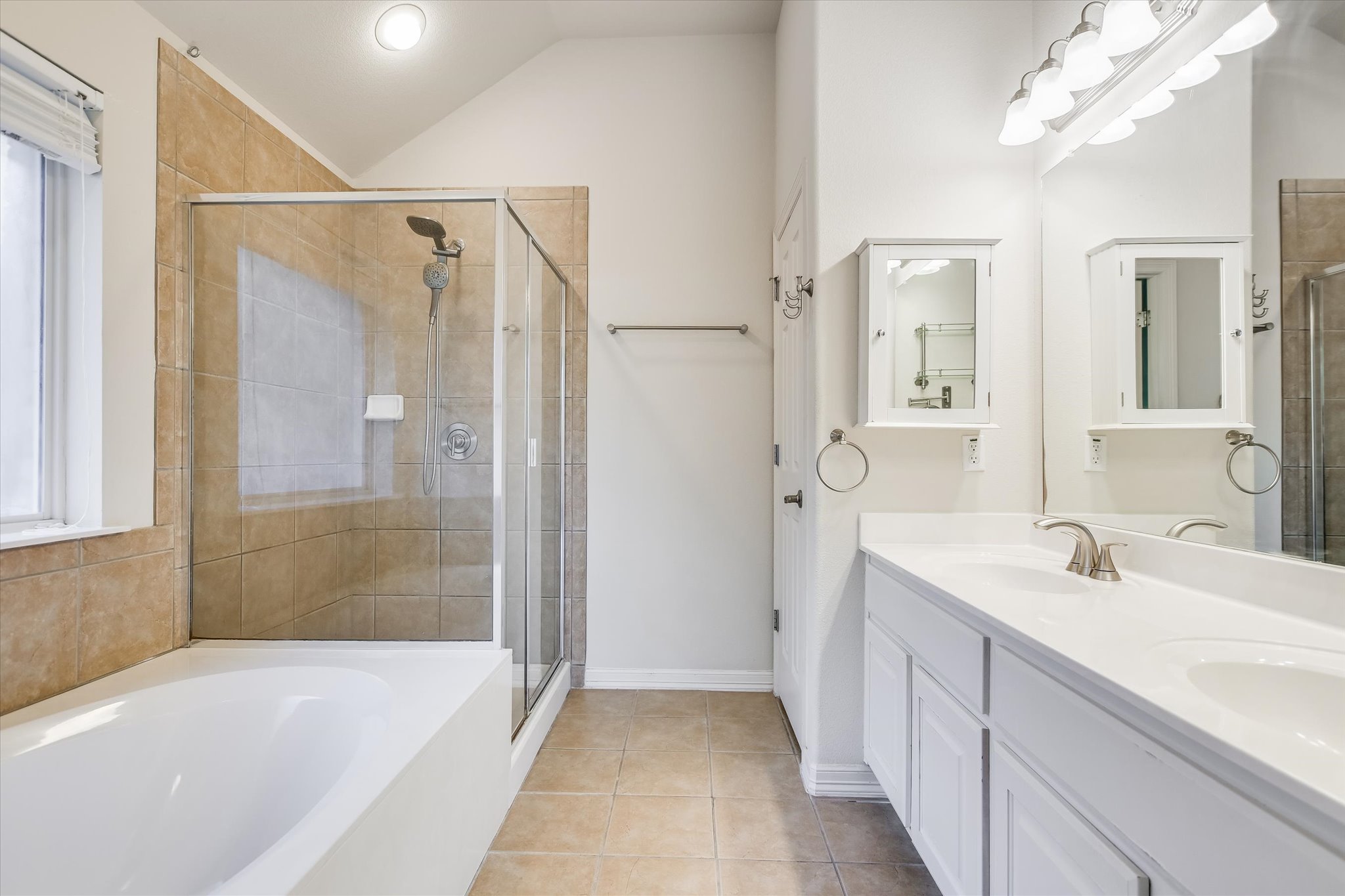 2300 Village View Loop Pflugerville, TX 78660 - Photo 12 of 25 a bathroom with a tub sink and mirror