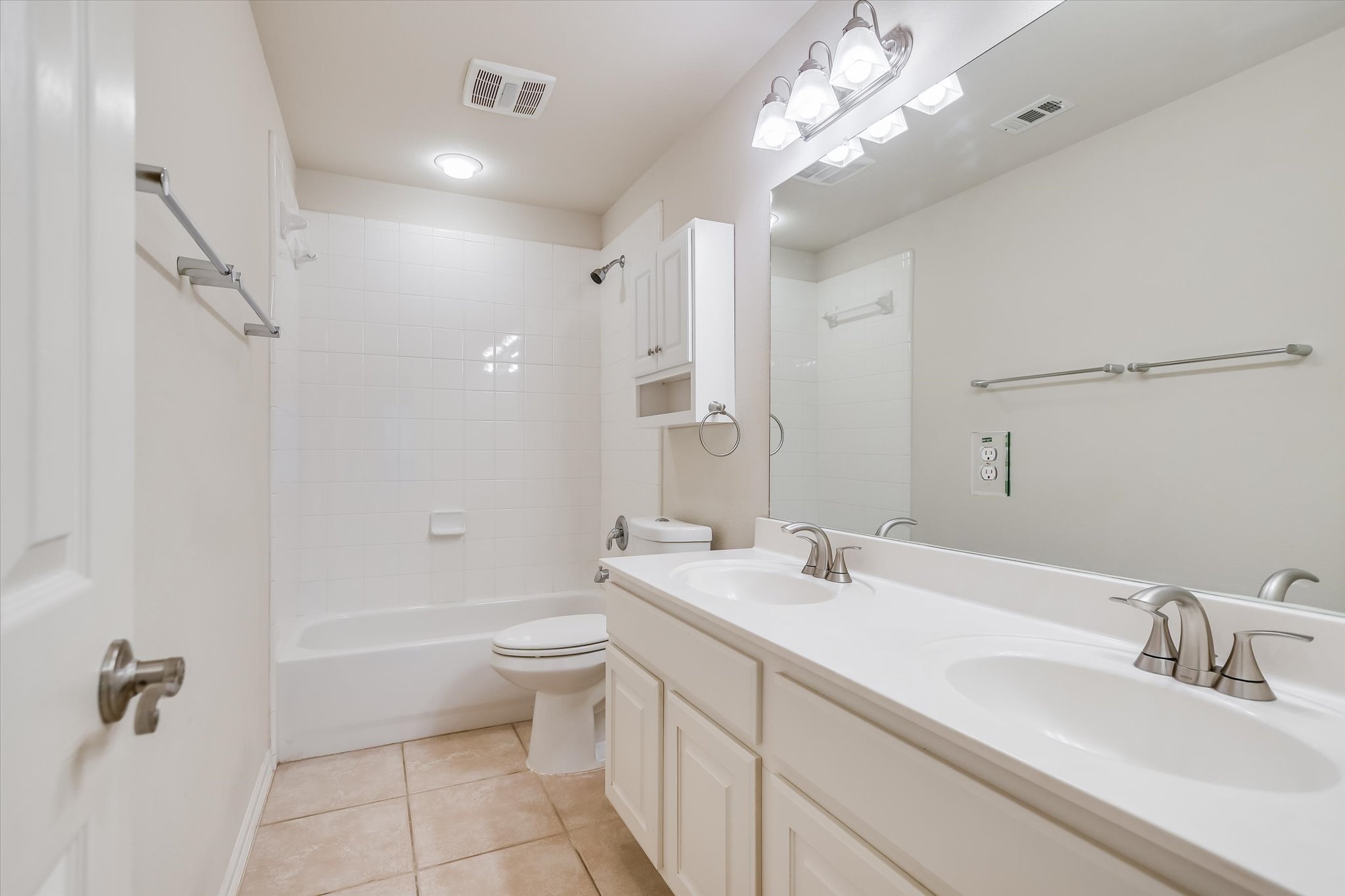 2300 Village View Loop Pflugerville, TX 78660 - Photo 14 of 25 a bathroom with a double vanity sink mirror and toilet