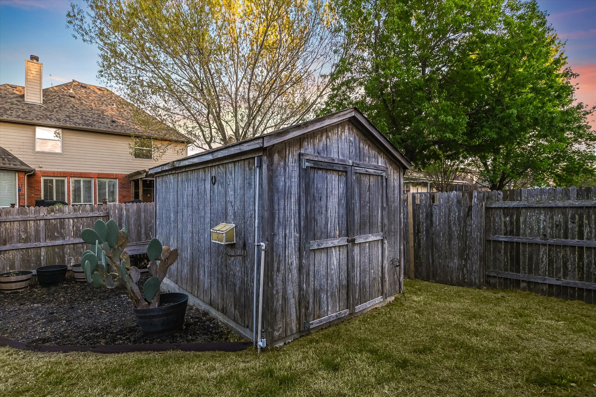 2300 Village View Loop Pflugerville, TX 78660 - Photo 16 of 25 a view of backyard with wooden fence and large trees
