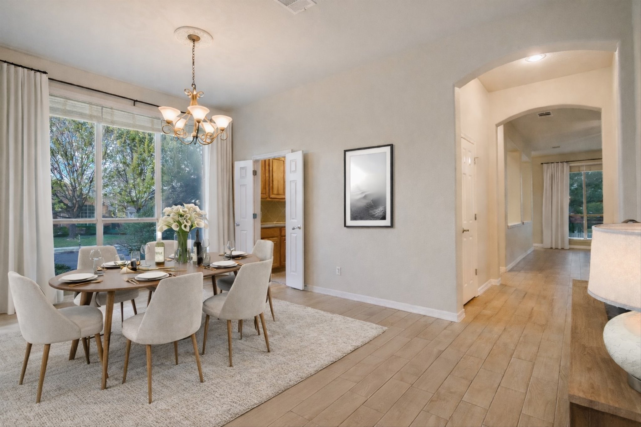 2300 Village View Loop Pflugerville, TX 78660 - Photo 4 of 25 a view of a dining room with furniture wooden floor and chandelier