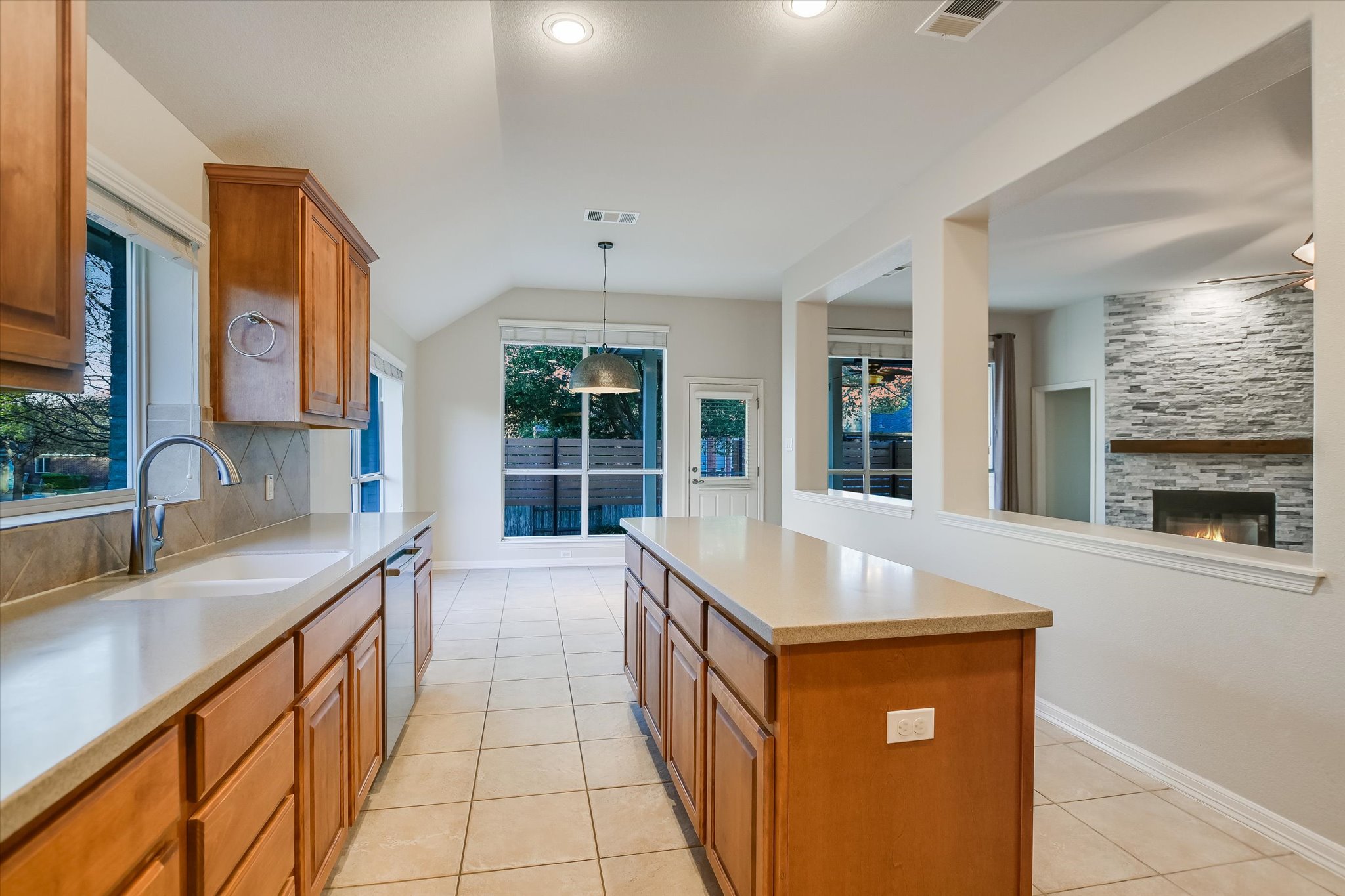 2300 Village View Loop Pflugerville, TX 78660 - Photo 6 of 25 a kitchen with stainless steel appliances granite countertop a sink and cabinets