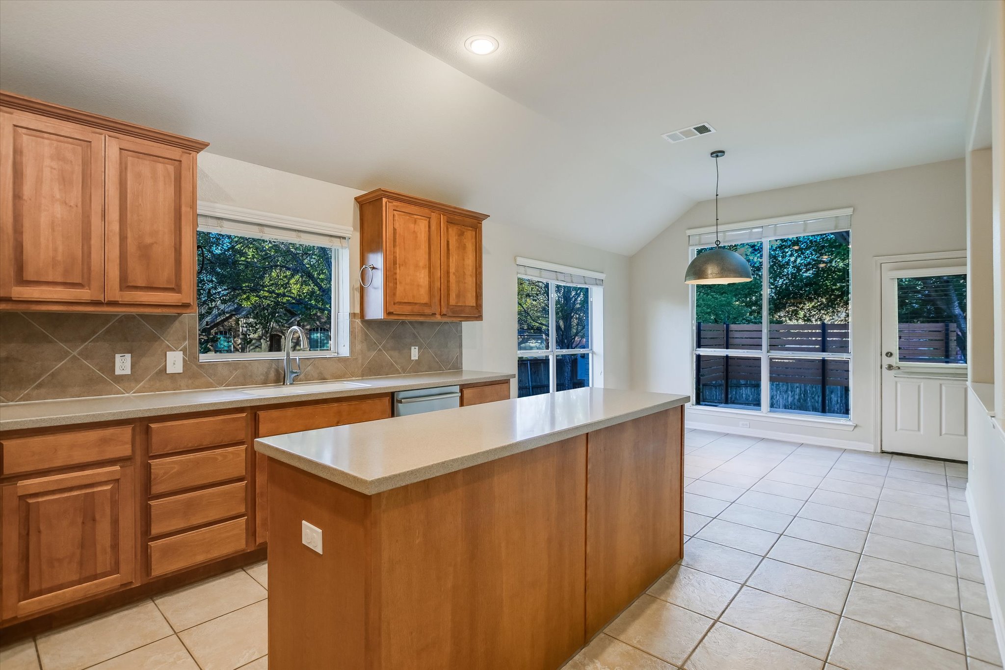 2300 Village View Loop Pflugerville, TX 78660 - Photo 7 of 25 a kitchen that has a sink and a stove in it