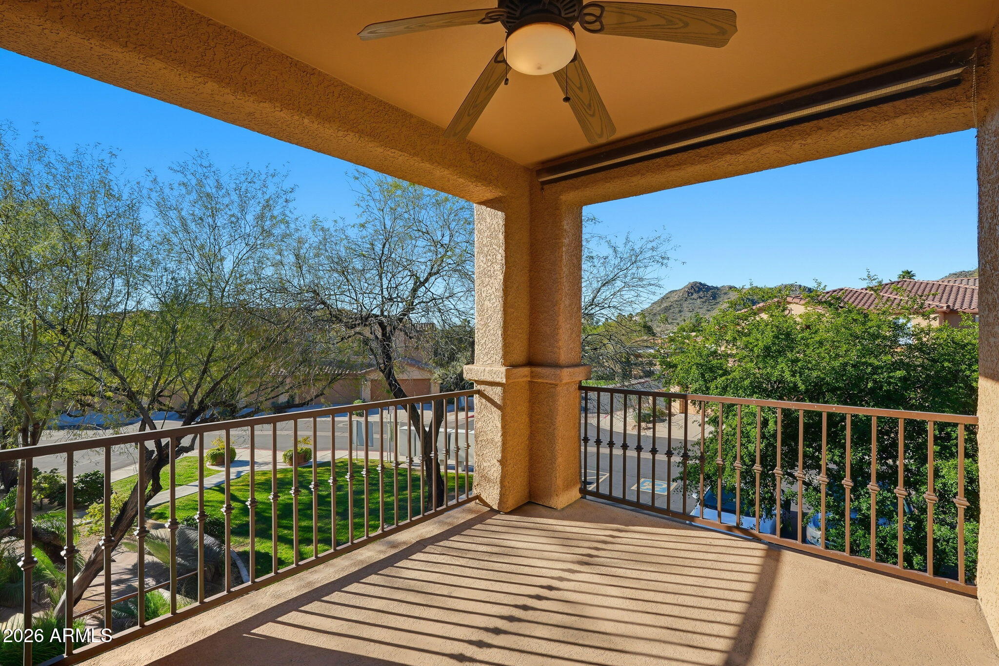 a view of a balcony with wooden floor