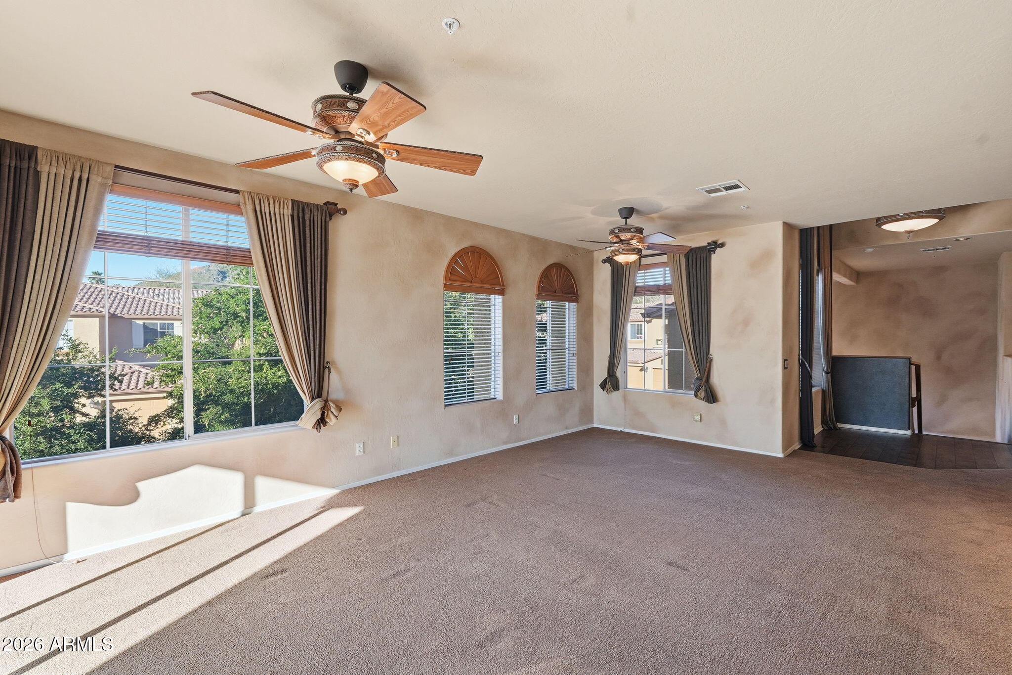 10655 North 9th Street, Unit 232 Phoenix, AZ 85020 - Photo 11 of 22 a view of a livingroom with a ceiling fan and window