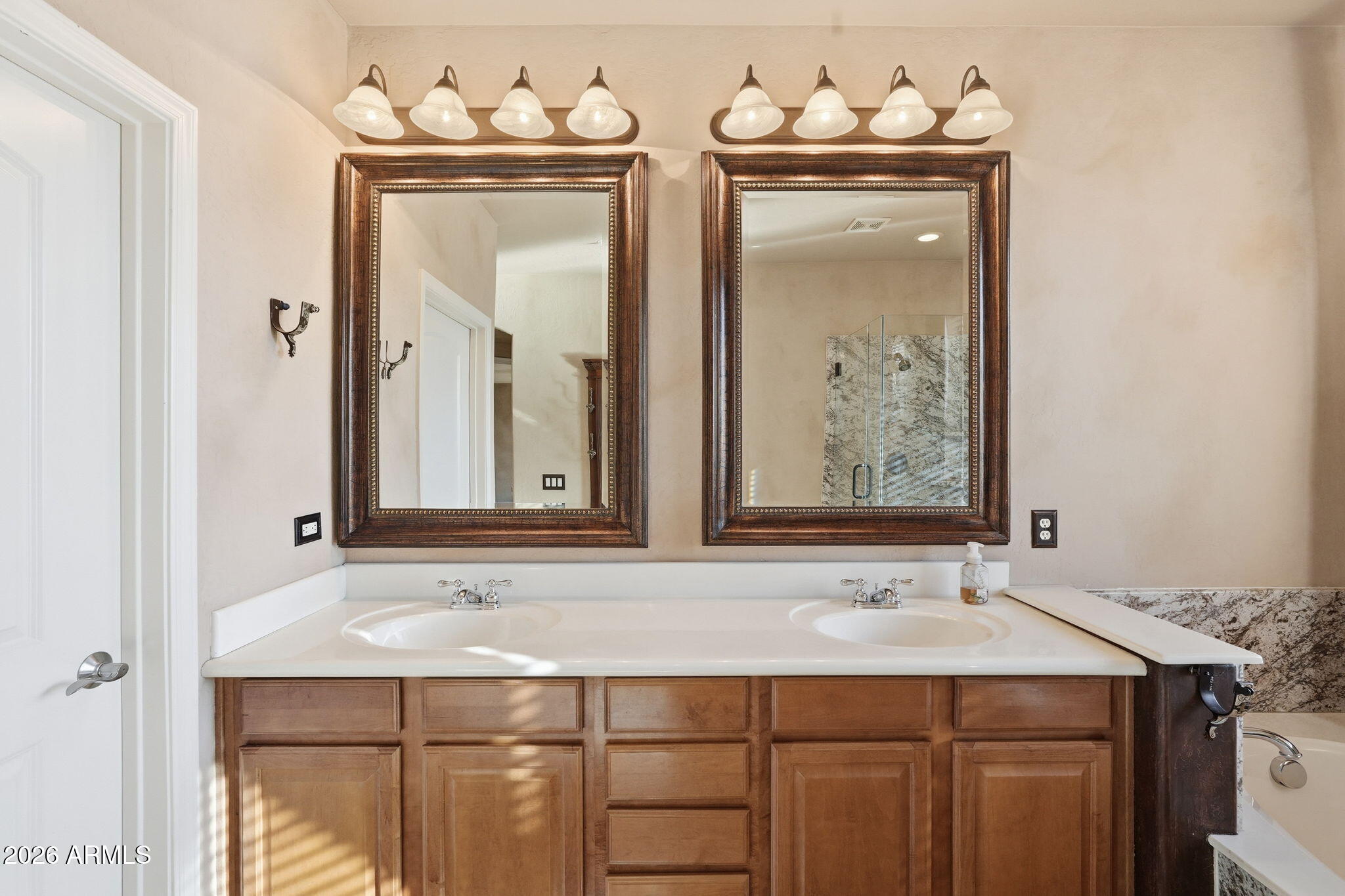 10655 North 9th Street, Unit 232 Phoenix, AZ 85020 - Photo 12 of 22 a bathroom with a sink and a mirror