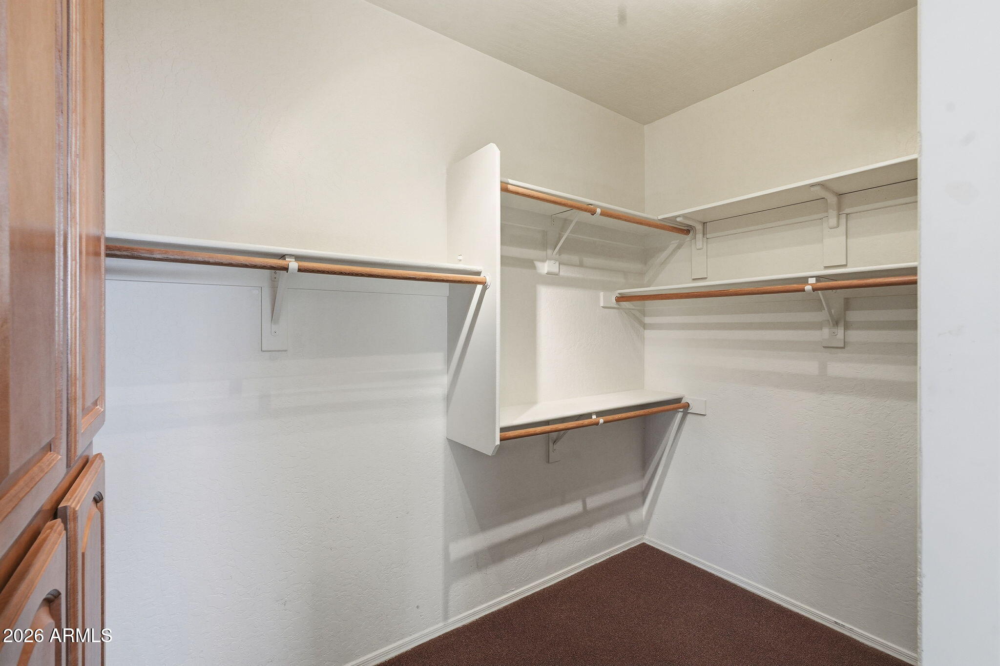 10655 North 9th Street, Unit 232 Phoenix, AZ 85020 - Photo 16 of 22 a view of walk in closet with empty racks