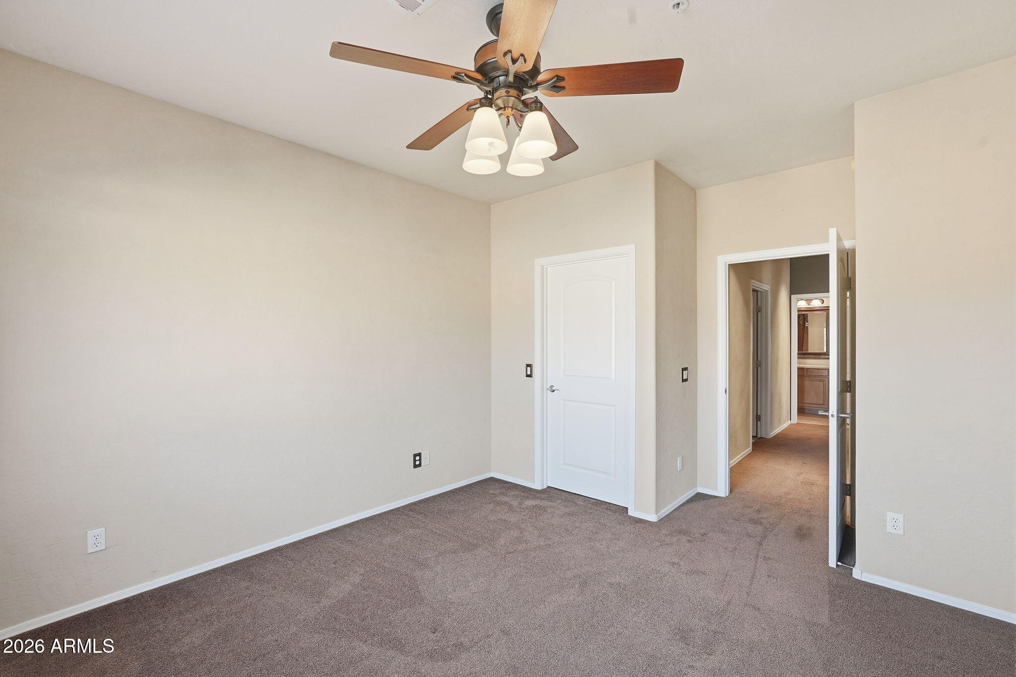 10655 North 9th Street, Unit 232 Phoenix, AZ 85020 - Photo 17 of 22 a view of a room with a ceiling fan and a window