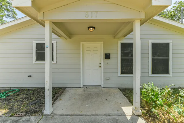 a front view of a house with a glass door