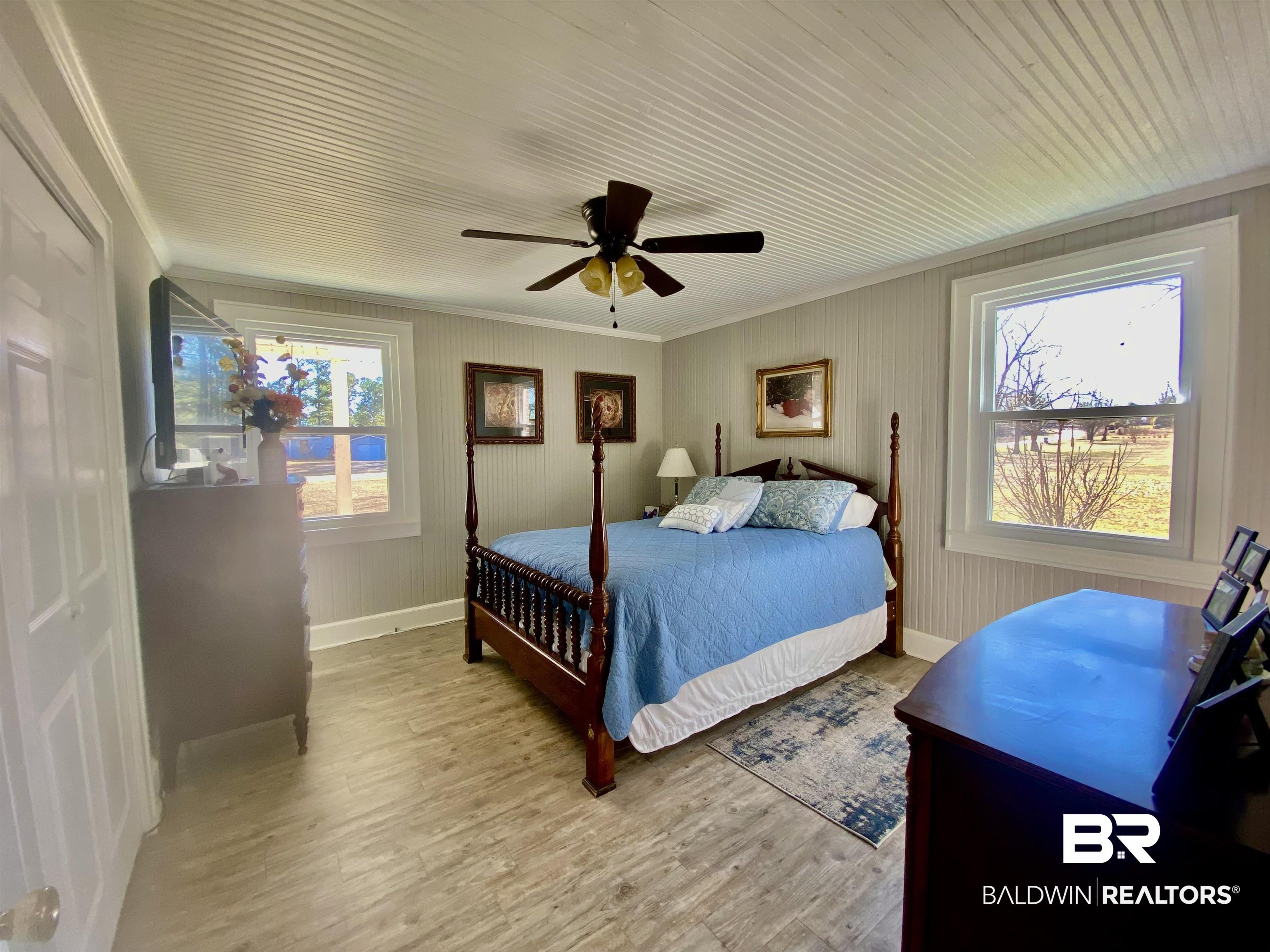 2711 County Road 5 Repton, AL 36475 - Photo 15 of 36 Bedroom featuring light wood-type flooring, ceiling fan, and crown molding