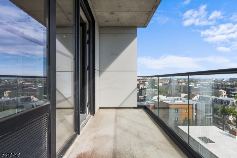 65 McWhorter Street, Unit 705 Newark, NJ 07105 - Photo 23 of 28 a view of a balcony with wooden floor