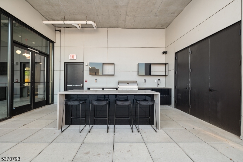 65 McWhorter Street, Unit 705 Newark, NJ 07105 - Photo 27 of 28 a large kitchen with cabinets
