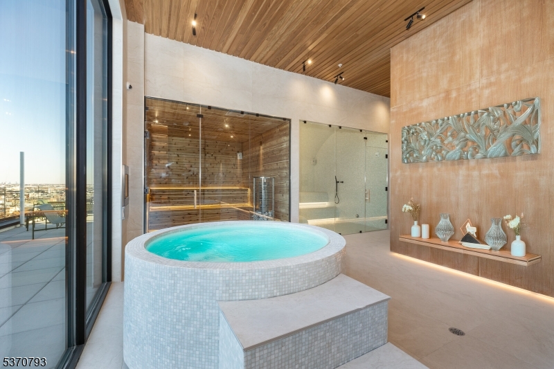 65 McWhorter Street, Unit 705 Newark, NJ 07105 - Photo 4 of 28 a living room with a couch and a table