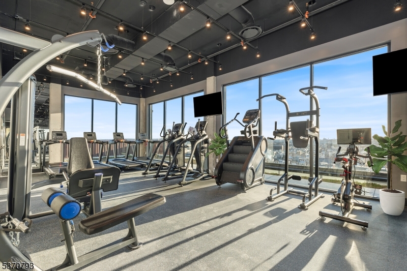 65 McWhorter Street, Unit 705 Newark, NJ 07105 - Photo 7 of 28 a view of a room with gym equipment