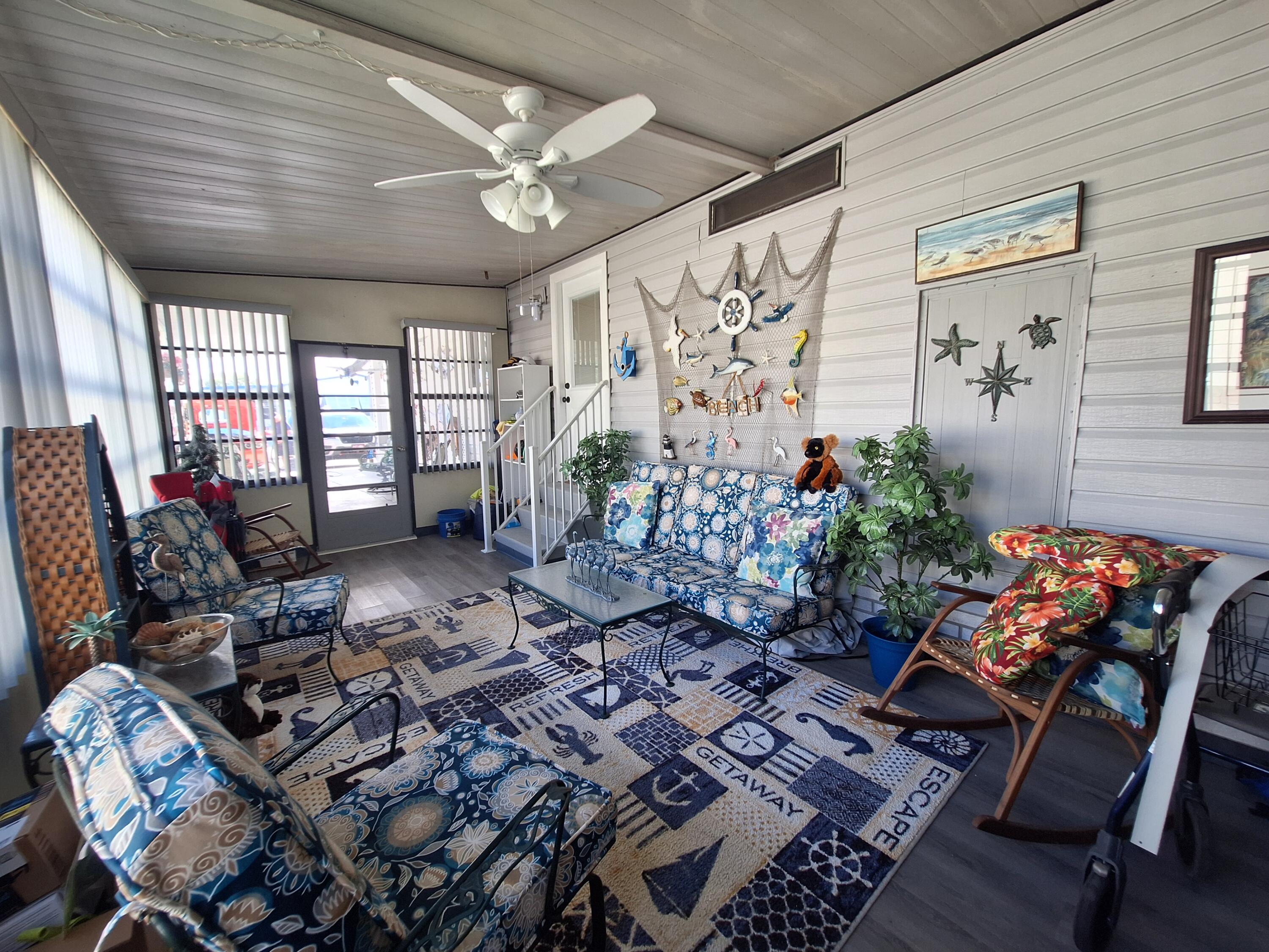 846 Periwinkle Circle Barefoot Bay, FL 32976 - Photo 20 of 23 a living room filled with furniture