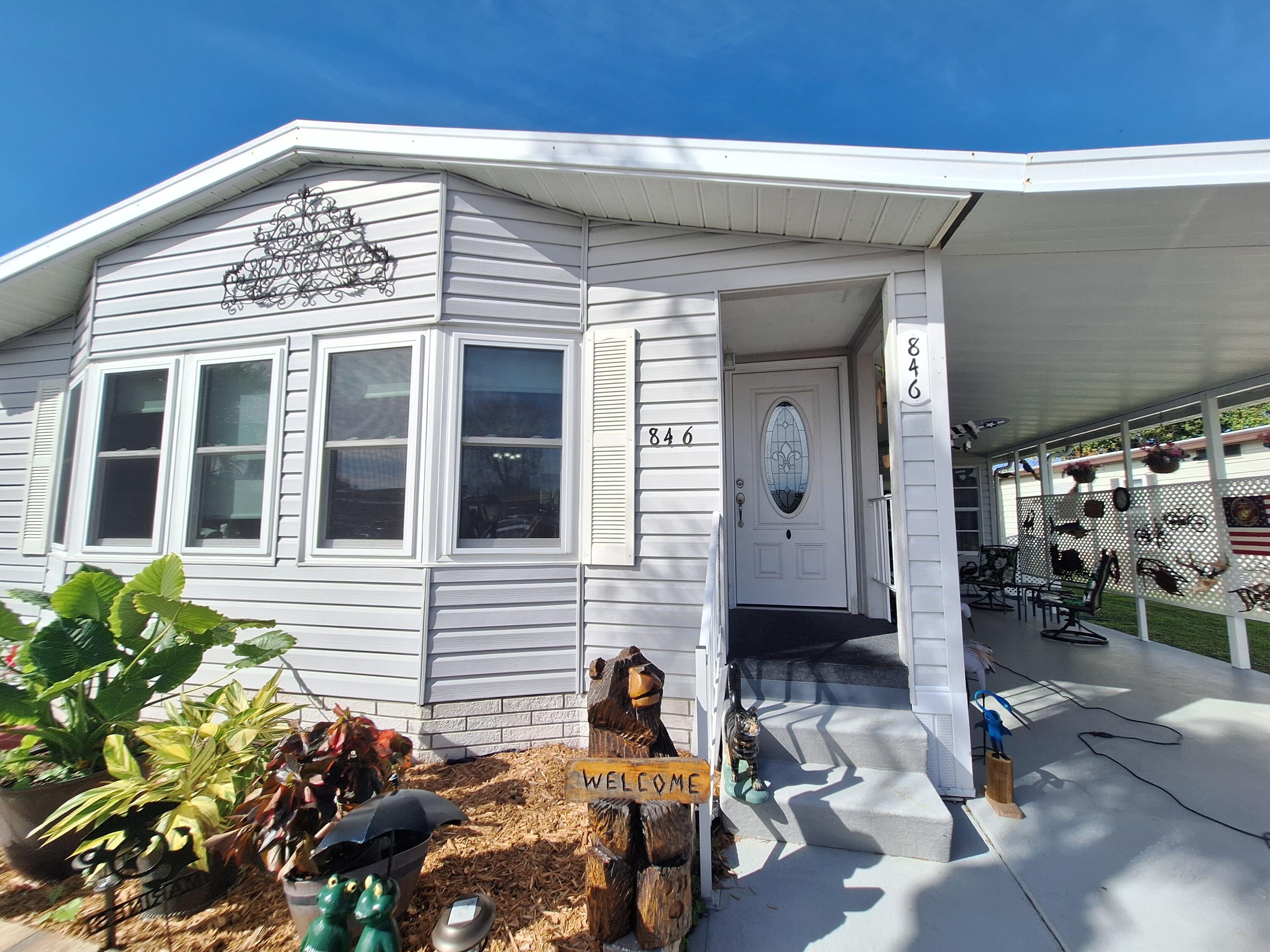 846 Periwinkle Circle Barefoot Bay, FL 32976 - Photo 2 of 23 a front view of a house