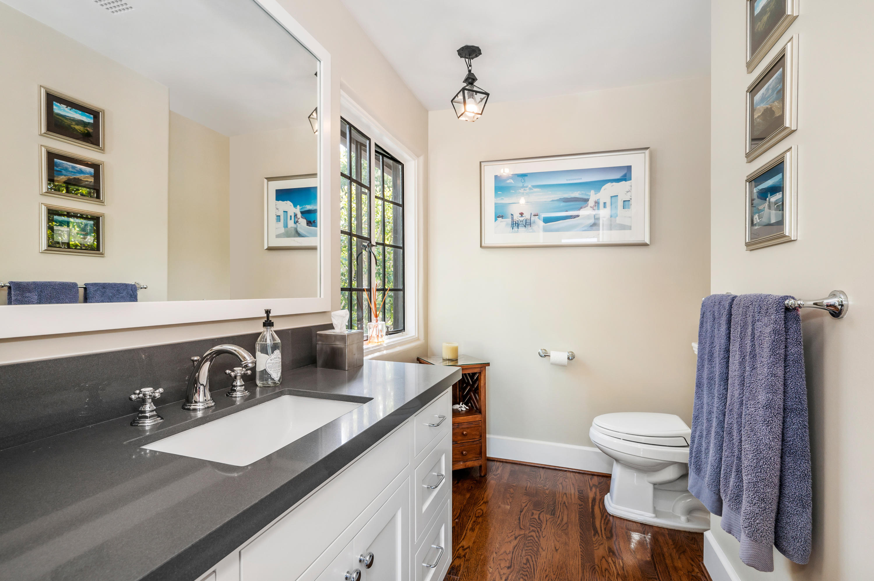 1321 School House Road Montecito, CA 93108 - Photo 15 of 34 a bathroom with a sink a toilet and a mirror