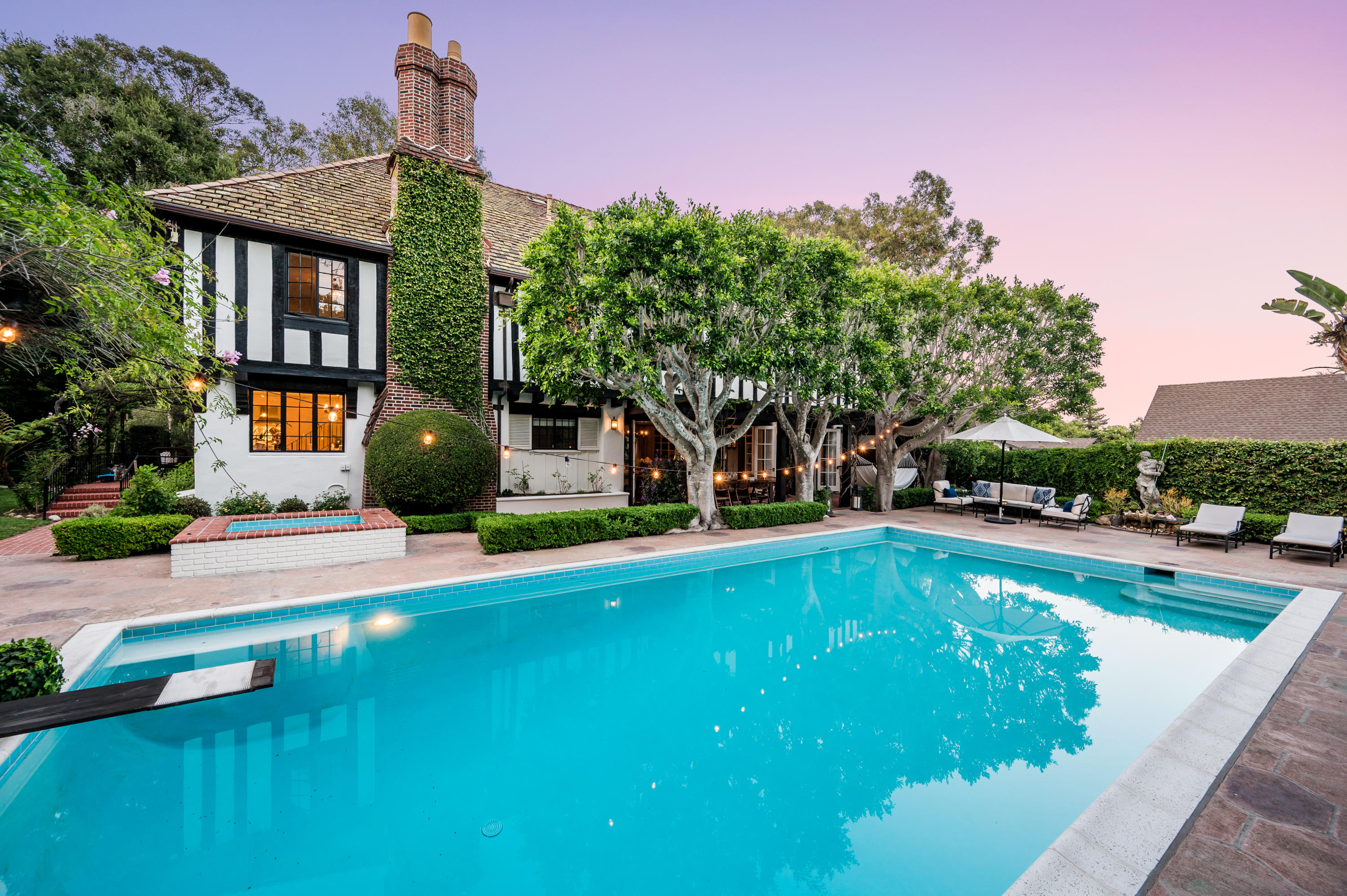 1321 School House Road Montecito, CA 93108 - Photo 23 of 34 a view of swimming pool with lawn chairs and plants