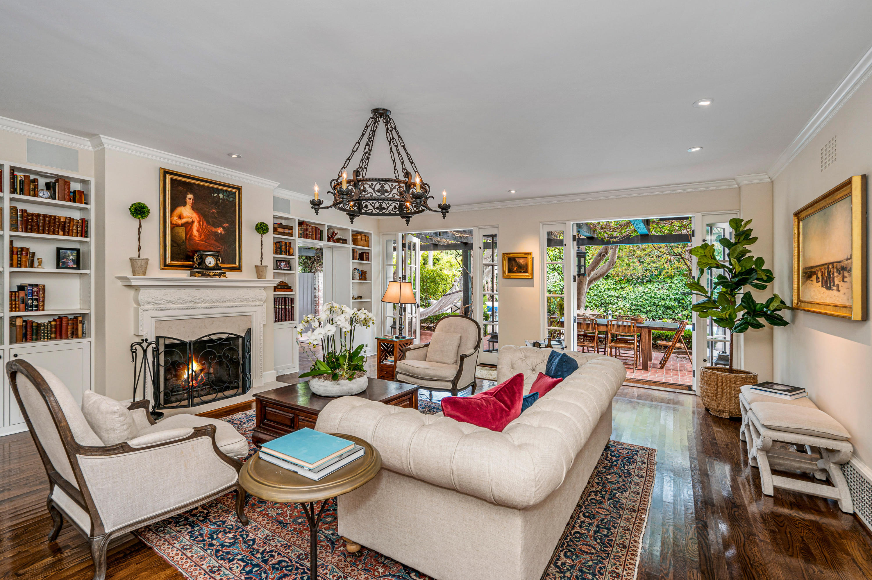 1321 School House Road Montecito, CA 93108 - Photo 4 of 34 a living room with furniture a fireplace and a flat screen tv