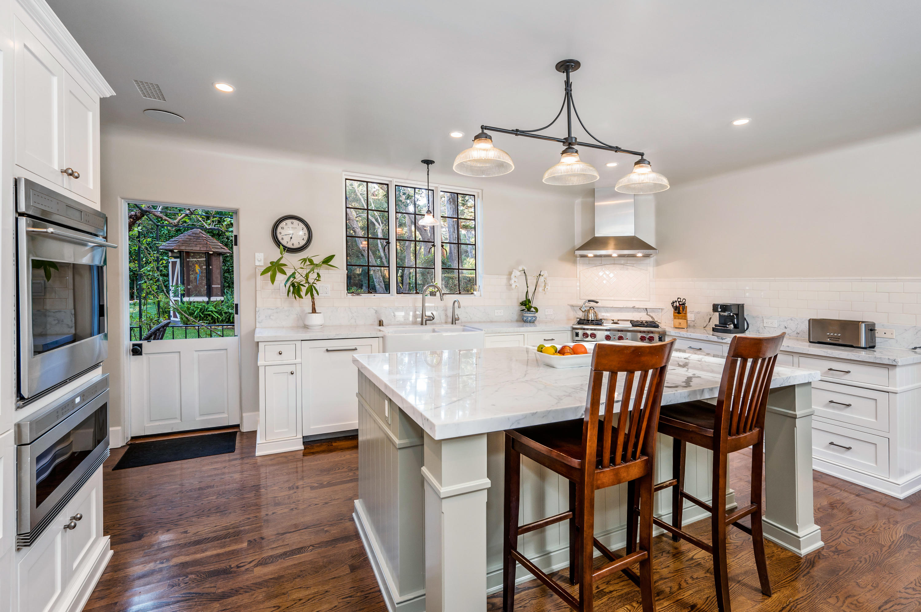 1321 School House Road Montecito, CA 93108 - Photo 6 of 34 a kitchen with a table chairs stove and cabinets