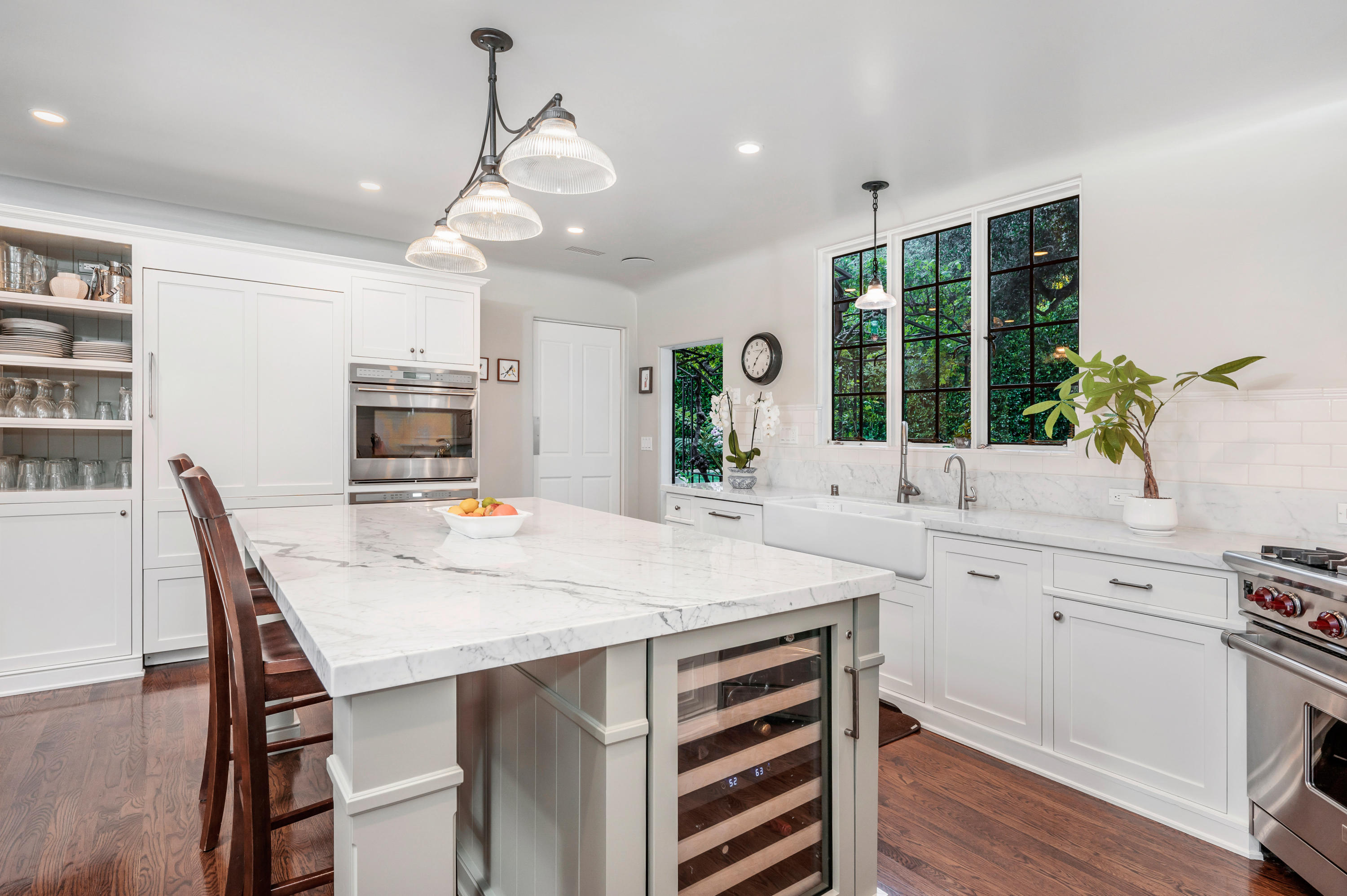 1321 School House Road Montecito, CA 93108 - Photo 7 of 34 a kitchen with stainless steel appliances a table chairs and chandelier