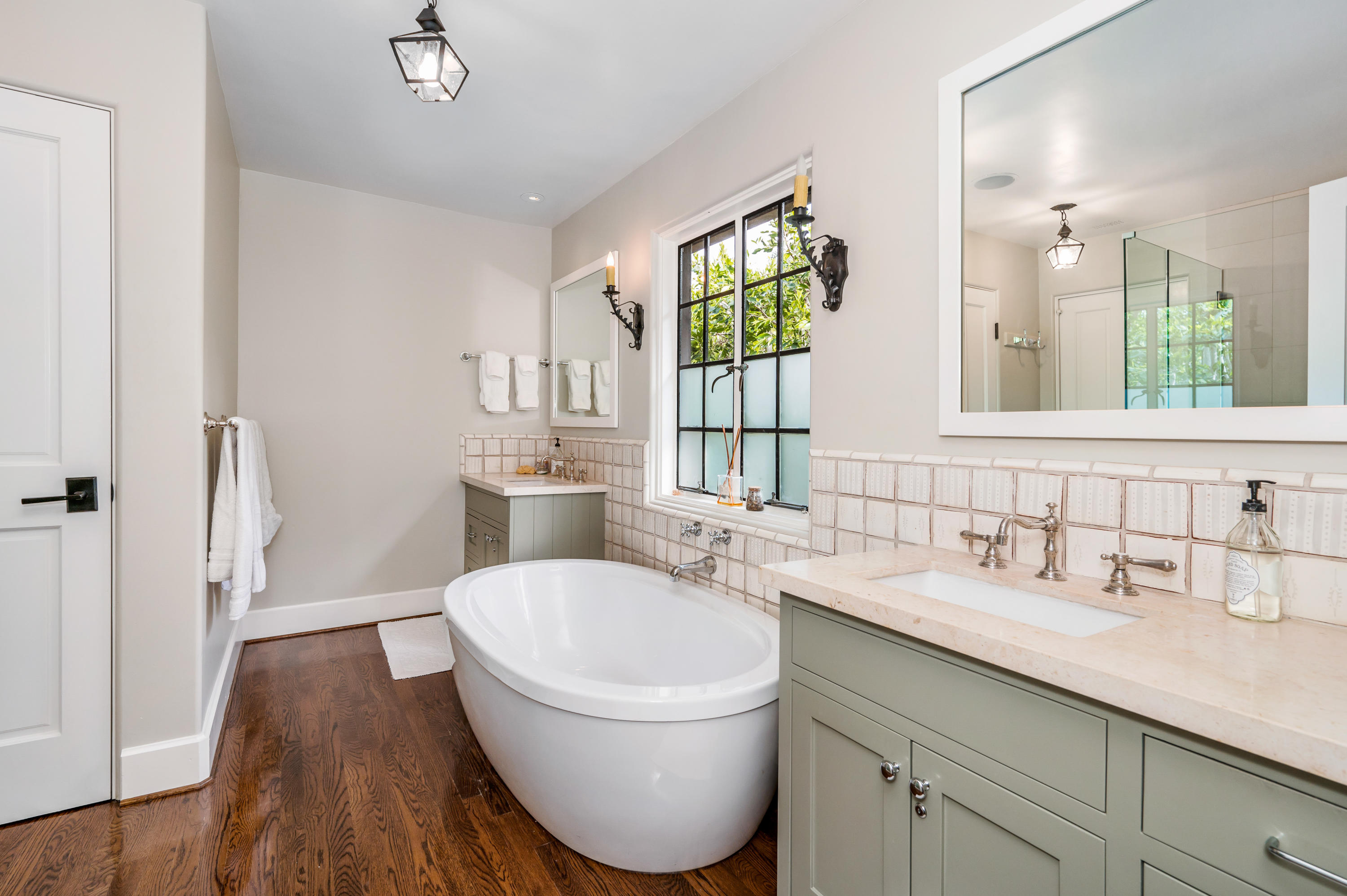 1321 School House Road Montecito, CA 93108 - Photo 10 of 34 a bathroom with a sink a toilet a mirror and a window