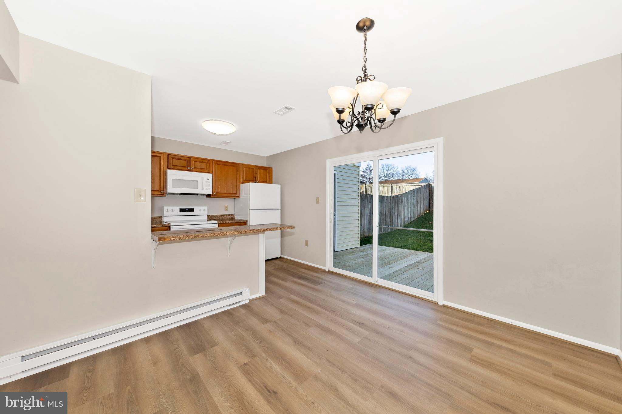 167 Stonegate Drive Frederick, MD 21702 - Photo 12 of 48 a view of a kitchen with a sink and dishwasher with wooden floor