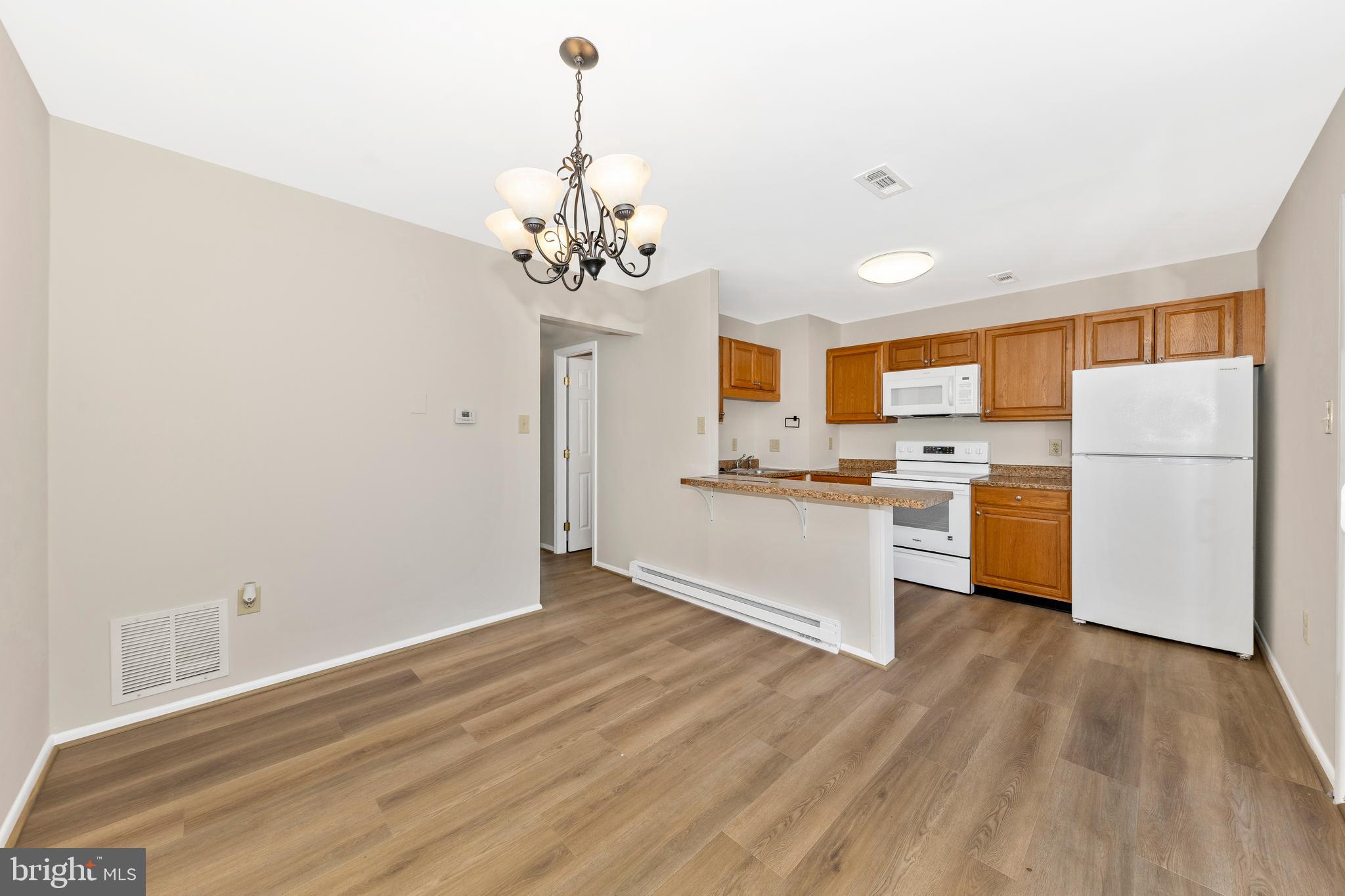 167 Stonegate Drive Frederick, MD 21702 - Photo 13 of 48 a kitchen with stainless steel appliances a refrigerator and a stove top oven