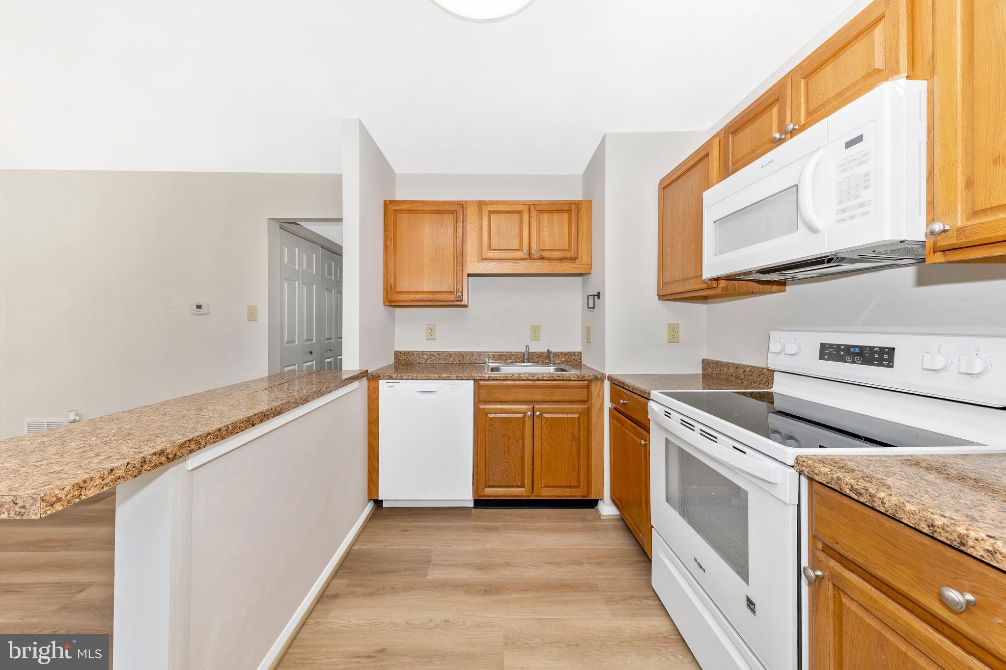 167 Stonegate Drive Frederick, MD 21702 - Photo 15 of 48 a kitchen with a stove top oven sink and cabinets