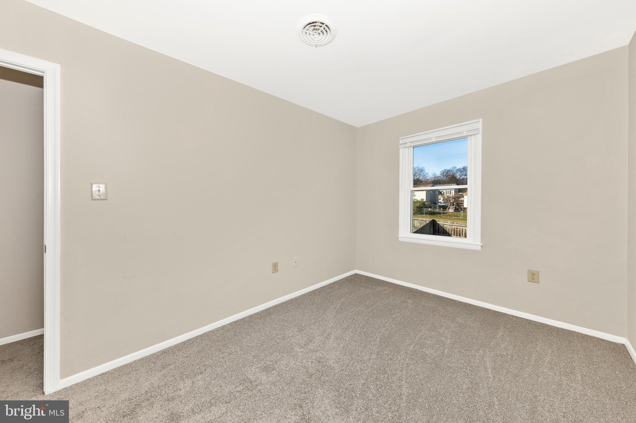 167 Stonegate Drive Frederick, MD 21702 - Photo 28 of 48 a view of an empty room with a window