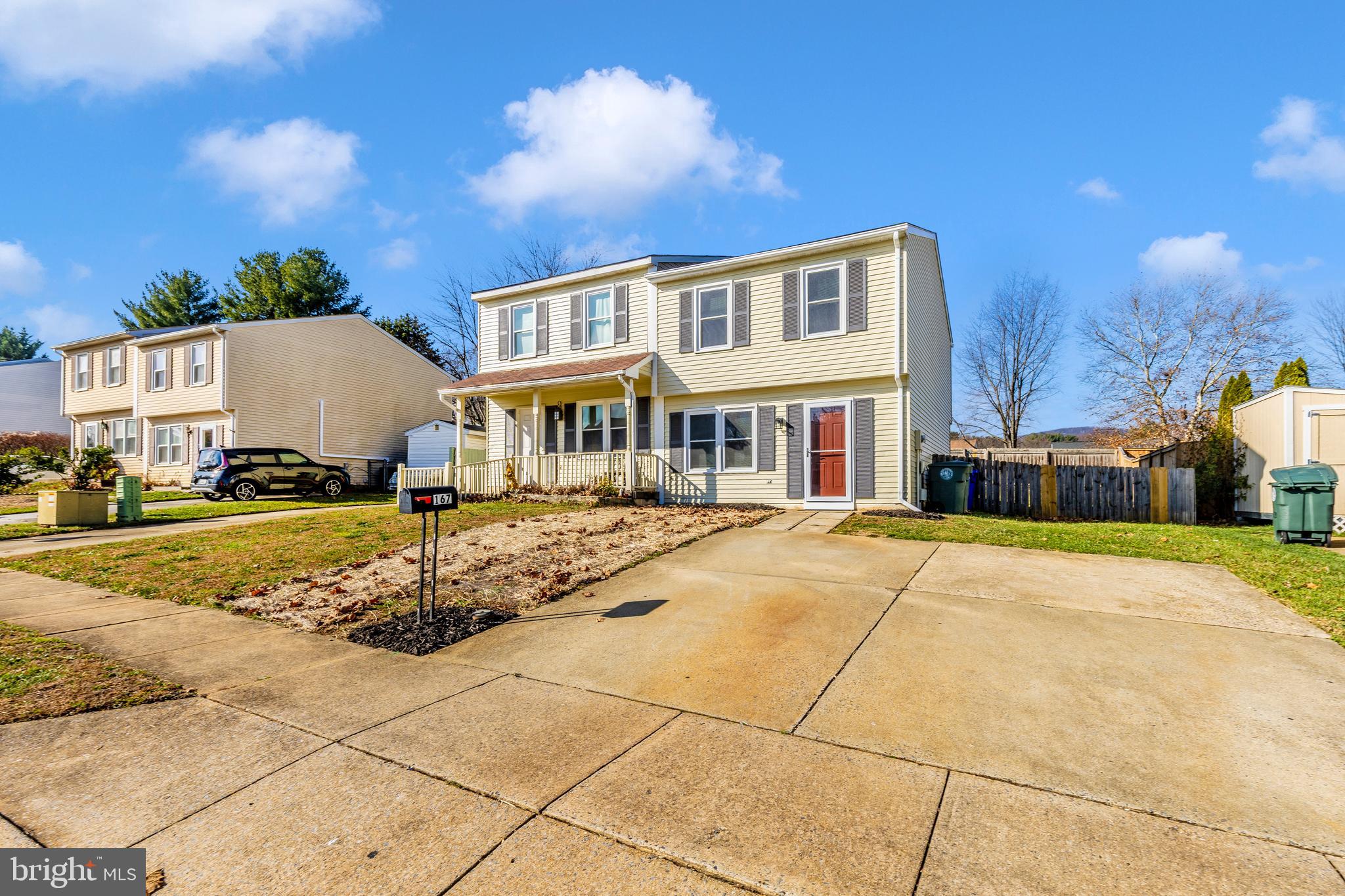 167 Stonegate Drive Frederick, MD 21702 - Photo 40 of 48 a front view of a house with a yard
