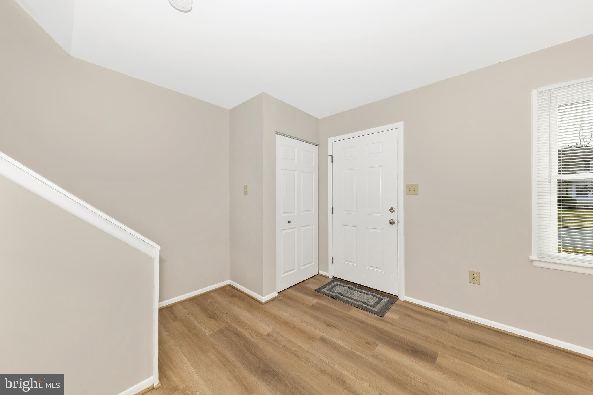 167 Stonegate Drive Frederick, MD 21702 - Photo 4 of 48 a view of empty room with wooden floor and fan