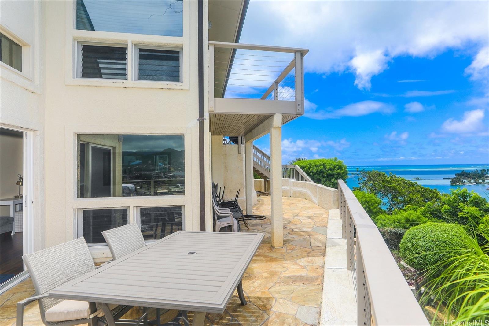 45-001 Lilipuna Road, Unit B Kaneohe, HI 96744 - Photo 21 of 22 a view of a balcony with table and chairs