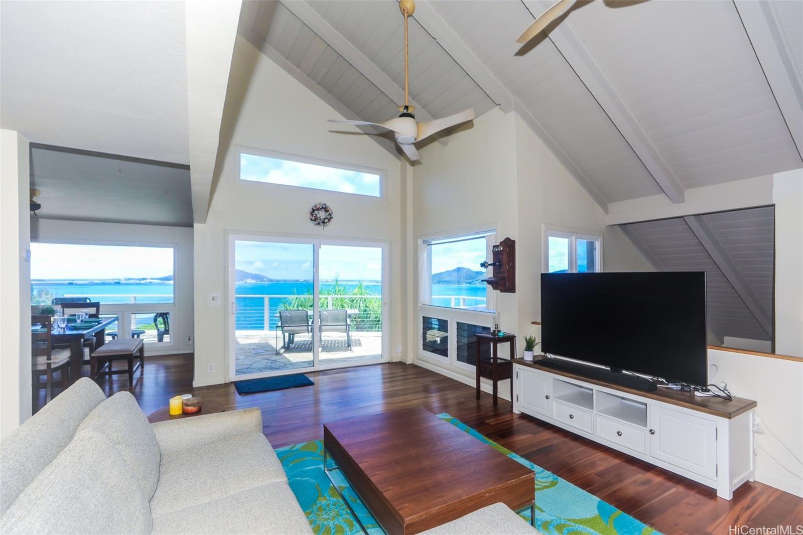 45-001 Lilipuna Road, Unit B Kaneohe, HI 96744 - Photo 6 of 22 a living room with furniture and a flat screen tv