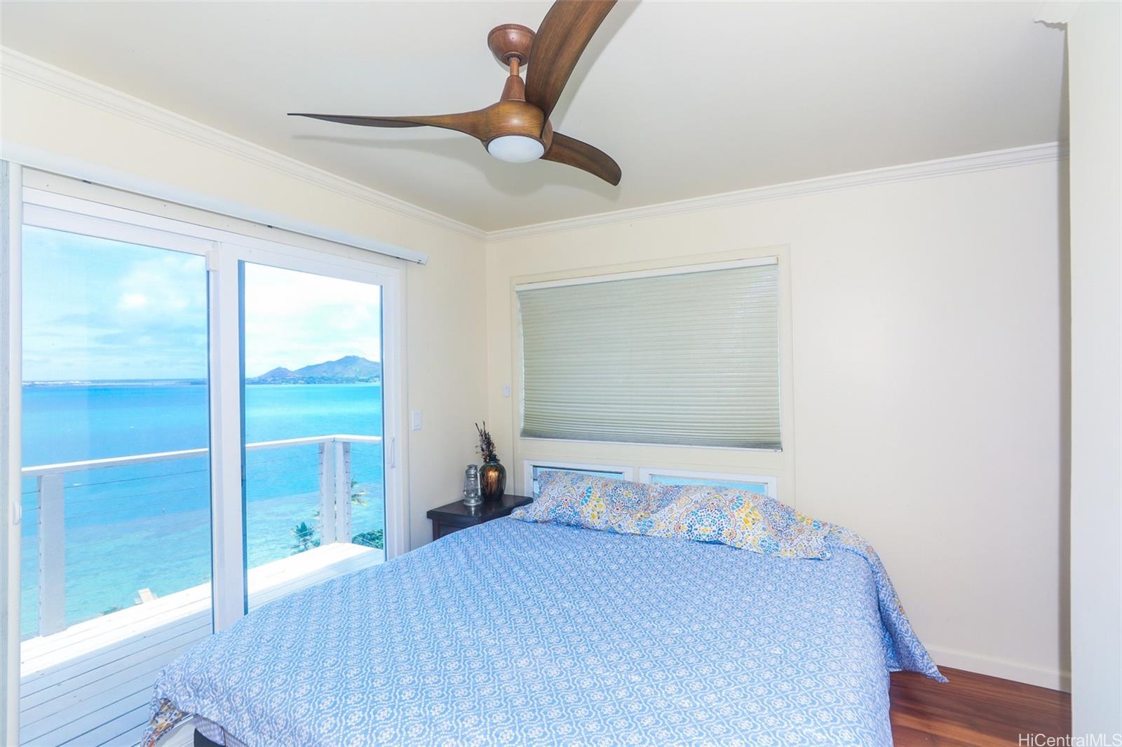 45-001 Lilipuna Road, Unit B Kaneohe, HI 96744 - Photo 9 of 22 a bedroom with a bed and a window