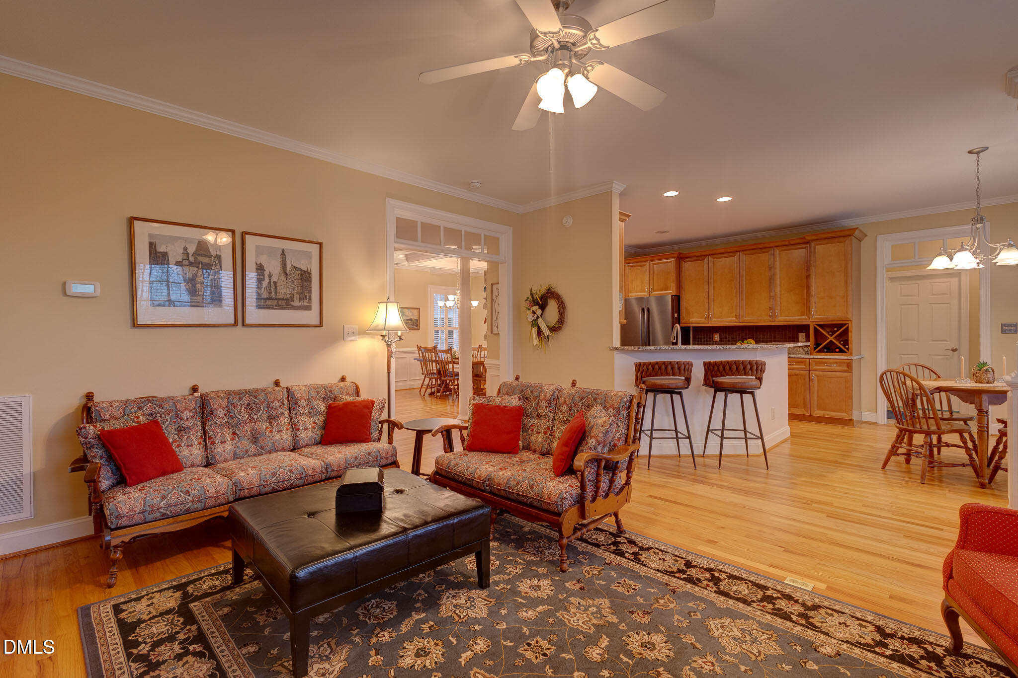 1116 Neuse Ridge Drive Clayton, NC 27527 - Photo 11 of 39 a living room with furniture and a view of kitchen