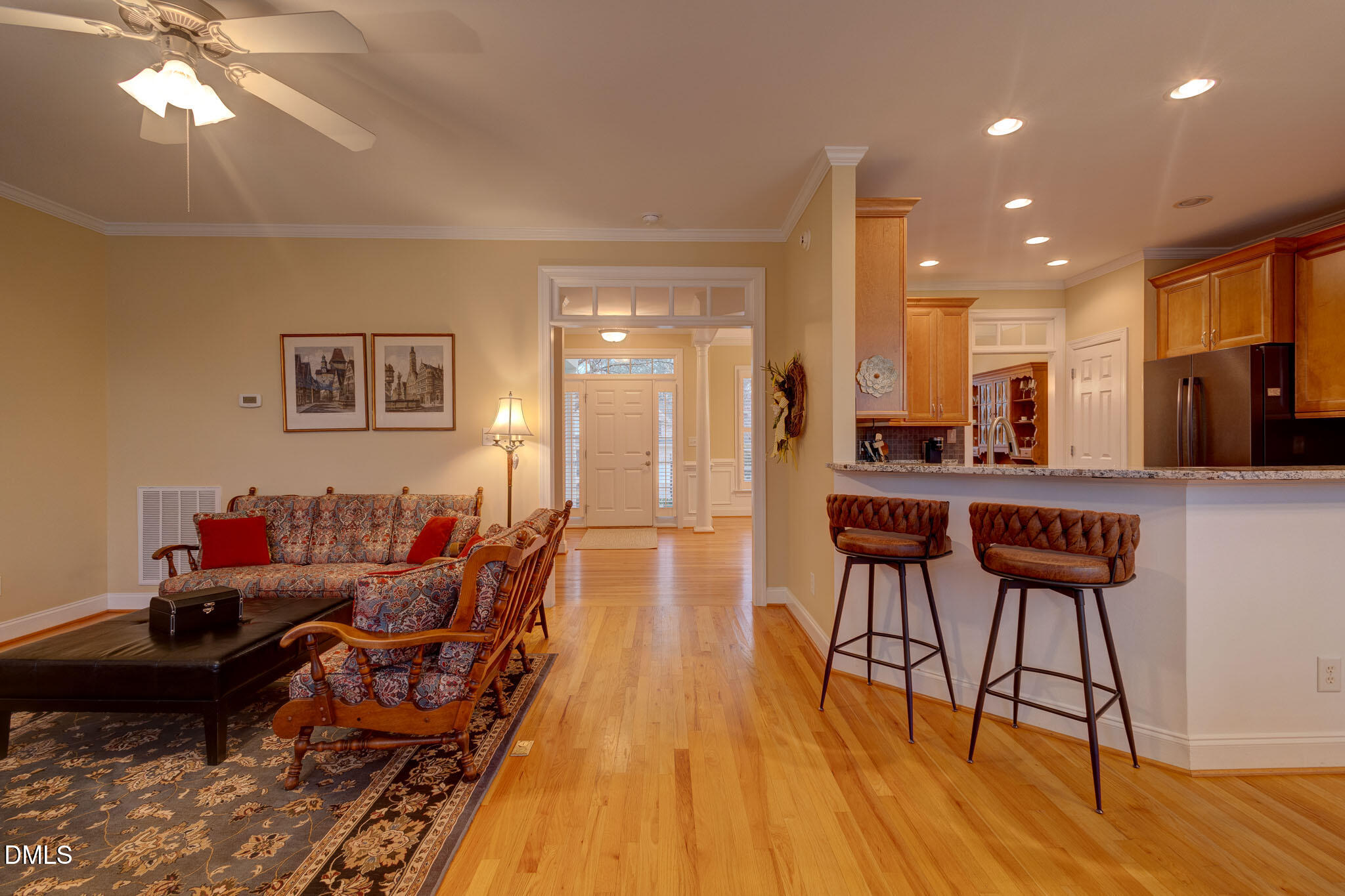 1116 Neuse Ridge Drive Clayton, NC 27527 - Photo 12 of 39 a living room with furniture and a wooden floor