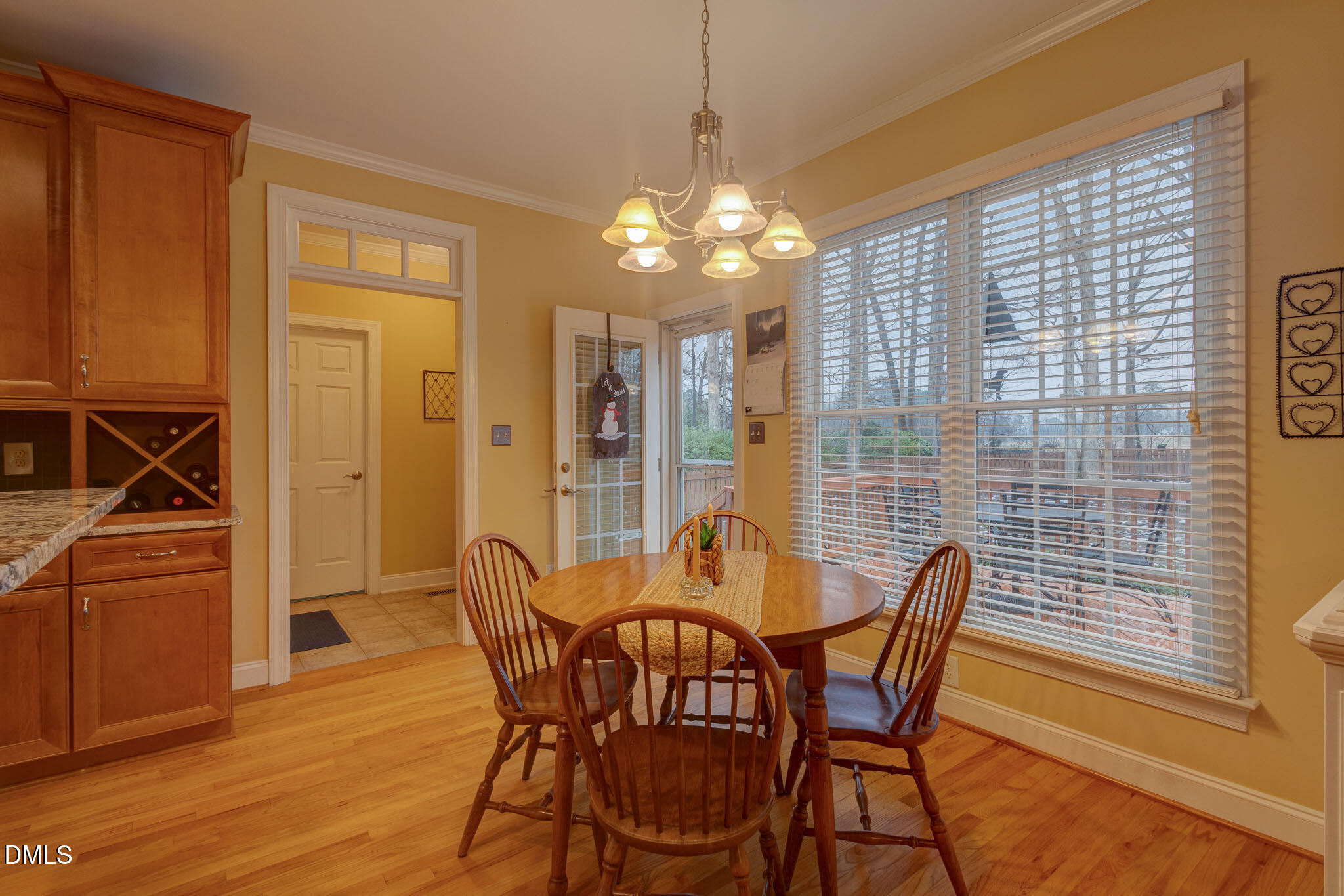 1116 Neuse Ridge Drive Clayton, NC 27527 - Photo 17 of 39 a view of a dining room with furniture and a chandelier
