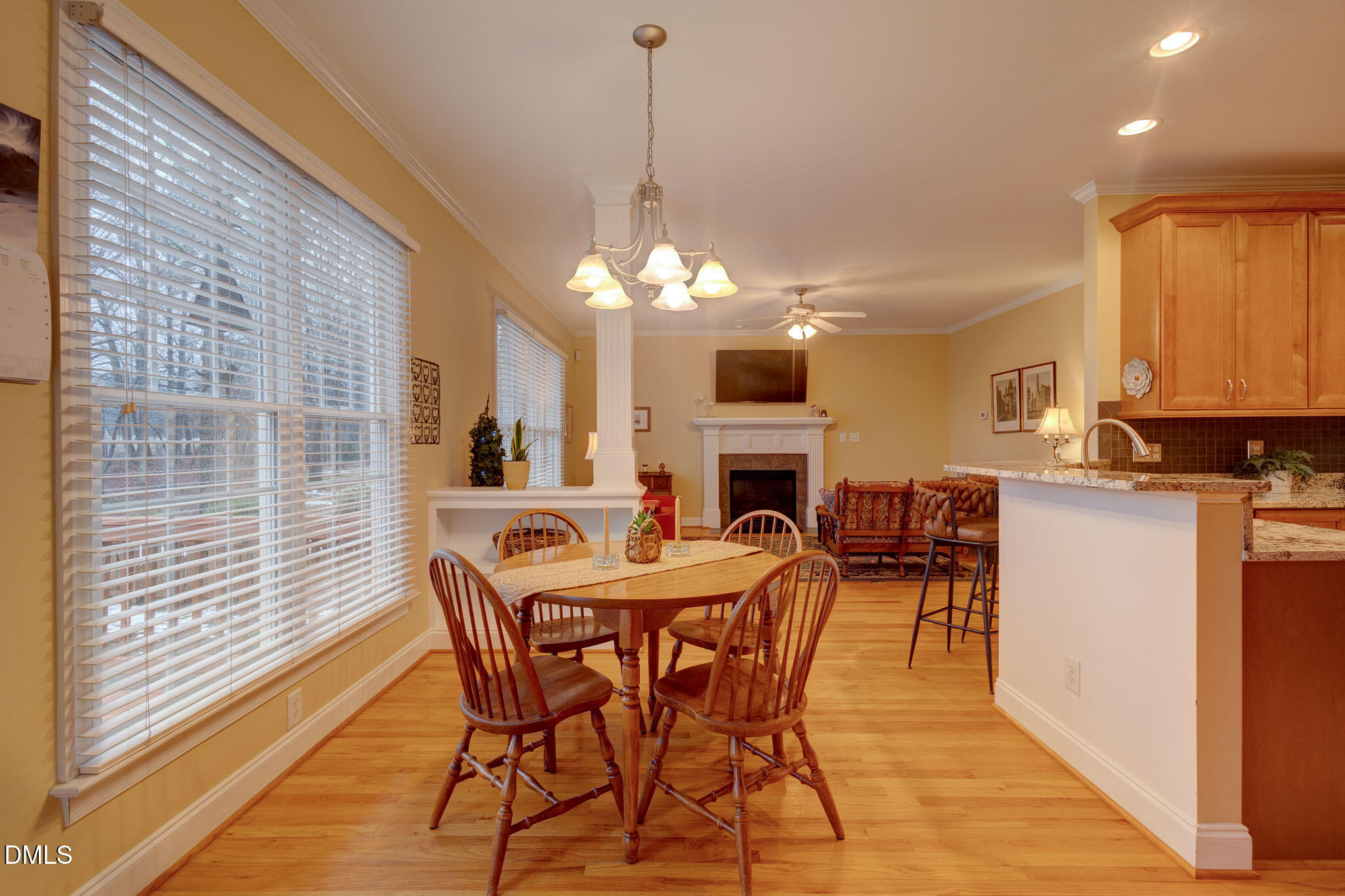 1116 Neuse Ridge Drive Clayton, NC 27527 - Photo 18 of 39 a view of a dining room with furniture and a chandelier
