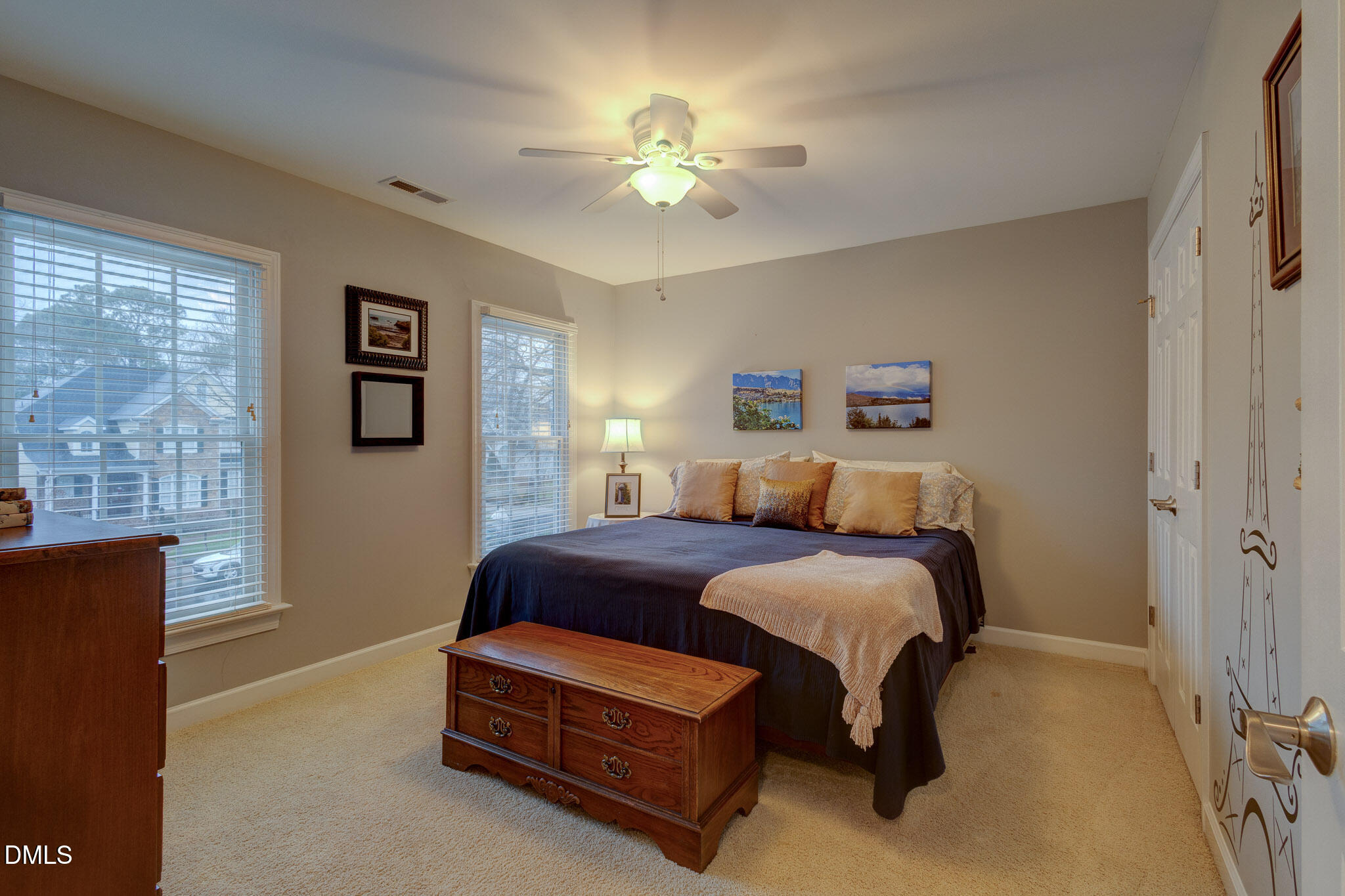 1116 Neuse Ridge Drive Clayton, NC 27527 - Photo 24 of 39 a bed room with a bed and a chandelier