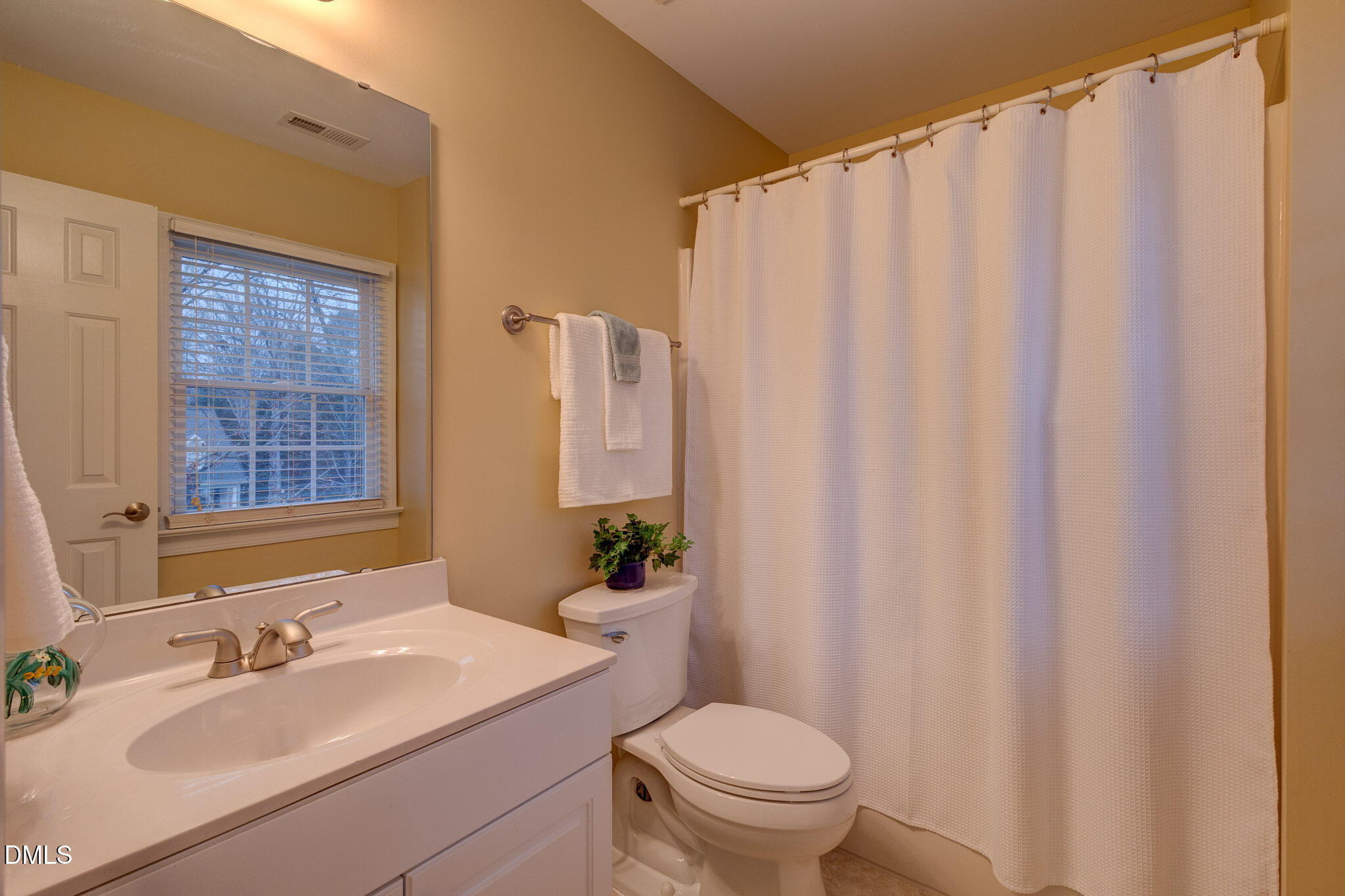 1116 Neuse Ridge Drive Clayton, NC 27527 - Photo 26 of 39 a bathroom with a sink toilet and shower