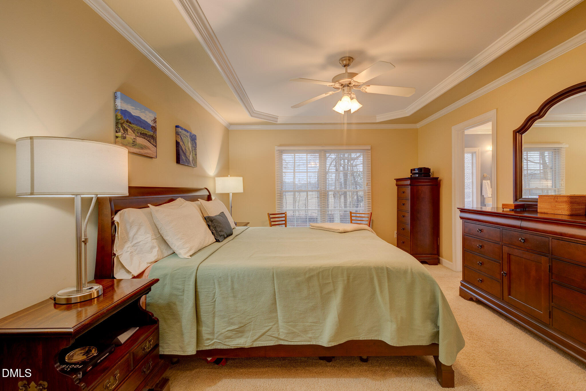 1116 Neuse Ridge Drive Clayton, NC 27527 - Photo 27 of 39 a bedroom with a bed and wooden floor