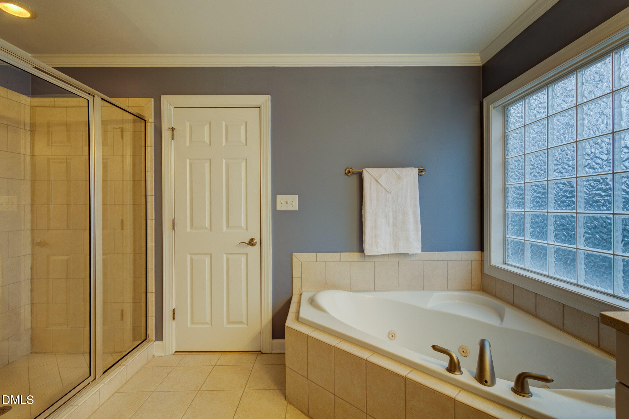 1116 Neuse Ridge Drive Clayton, NC 27527 - Photo 31 of 39 a bathroom with a tub and shower